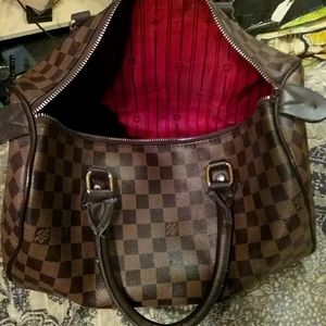 Identical Brown leather Louis Vuitton purse bag.